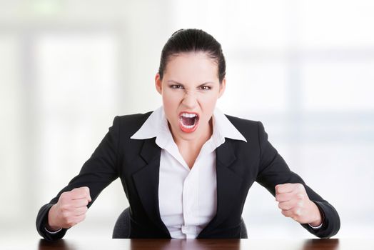 Stressed or angry businesswoman screaming loud