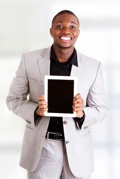 Businessman showing tablet computer