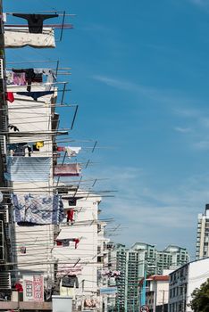 Shanghai, China - April 7, 2013: clothesline on building at the city of Shanghai in China on april 7th, 2013