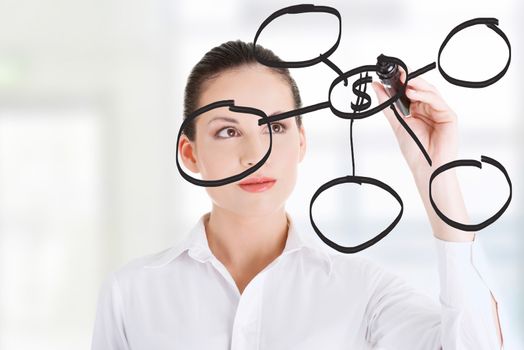 Young businesswoman writing something on abstract screen