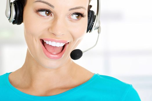 Beautiful young call-center assistant smiling , isolated