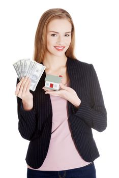 Beautiful business woman holding dollar currency and house. Isolated on white.