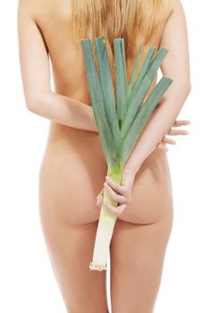 Beautiful naked woman's back, and holding leek. Isolated on white.