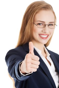 Beautiful business woman with her thumb up, showing oK. Isolated on white.