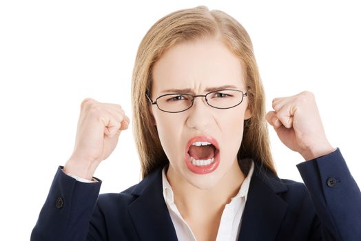 Angry and furious business woman with open mouth is screaming. Isolated on white.