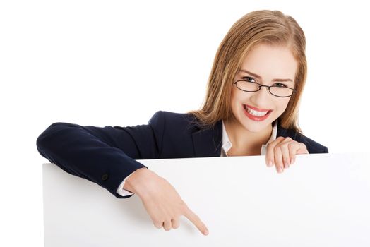 Beautiful business woman holding empty board, copy space. Isolated on white.