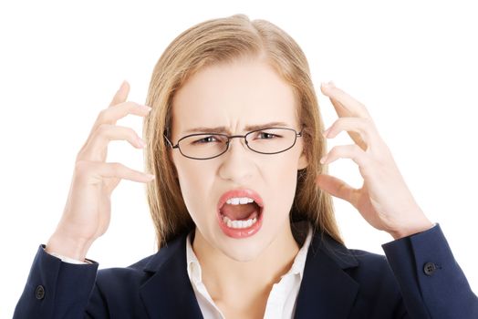 Angry and furious business woman with open mouth is screaming. Isolated on white.