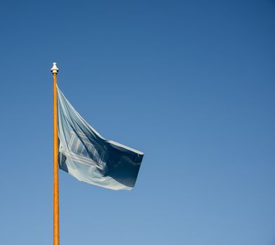 uneso flag and blue sky