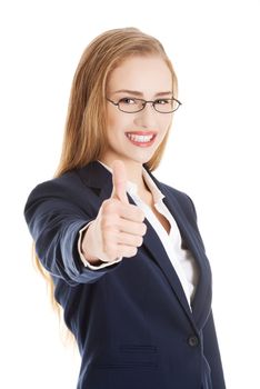 Beautiful business woman with her thumb up, showing oK. Isolated on white.