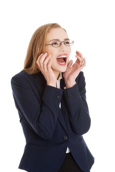 Shocked, surprised beautiful business woman. Isolated on white.