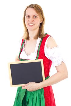 Attractive woman in red green dirndl showing clean blackboard
