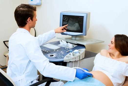 young pregnant woman on the ultrasound, health check