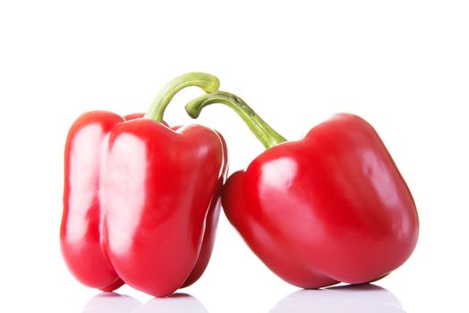 Two red paprika vegetable. Isolated on white.