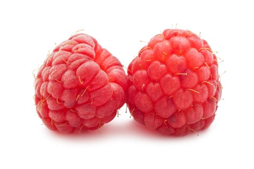 Ripe red raspberries isolated on white background