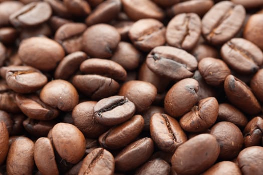 Close-up of brown coffee beans, background texture