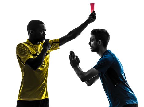 two men soccer player and referee showing red card in silhouette on white background