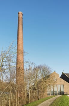 the 60 meter high chmney at the ir. D.F. Woudagemaal in Lemmer, opened in 1920 by Queen Wilhelmina, is the largest steam-driven pumping station in the world still in use
