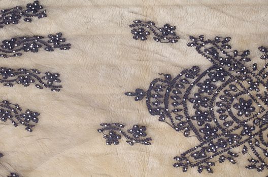 Handmade black embroidery work using shiny beads