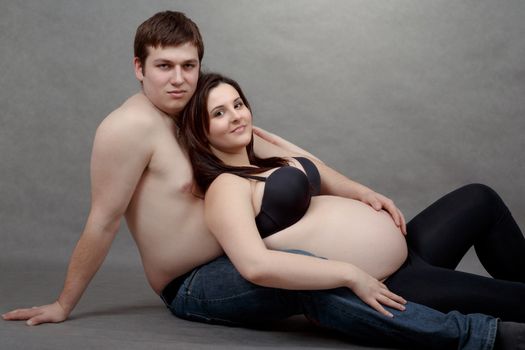 Loving happy couple, pregnant woman in love with her husband, romantic scene
