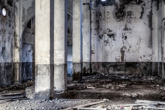 Urban decay, old gold smelting factory interior with pillars