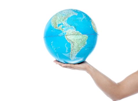Man hand holding a globe, isolated in white