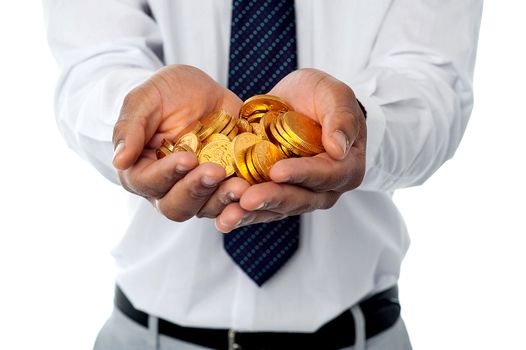 Closeup shot of businessman holding gold coins
