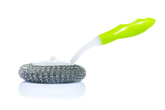 kitchen scrubbrush with green handle isolated