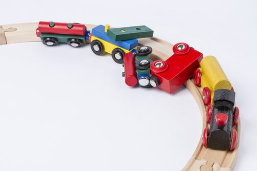 derail wooden toy train in top view. horizontal image