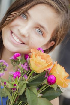 Pretty Young Girl Holding A Flower Bouquet at the Street Market.