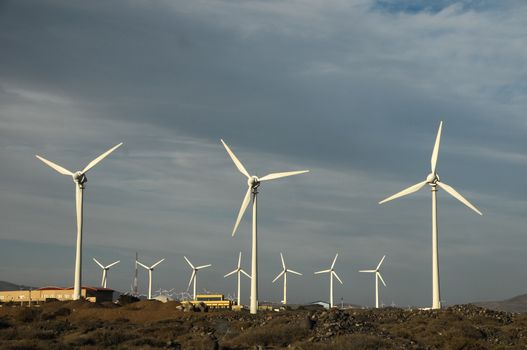 Eletric Power Generator Wind Turbine over a Cloudy Sky