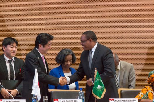H.E. Mr. Hailemariam Dessalegn, Prime Minister of the Federal Republic of Ethiopia shakes hands with H.E. Mr. Shinzo Abe, Prime Miinister of Japan on January 14, 2014, at the African Union Headquarters in Addis Ababa, Ethiopia.