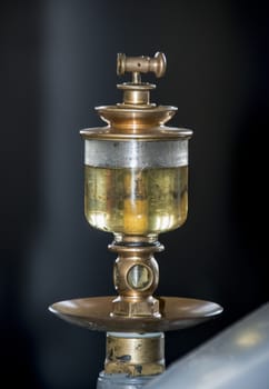 hundred year old oil sight glass with copper used in industry to view oil level at pumps