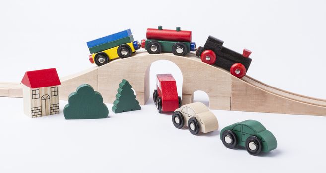toy traffic with car and train isolated on grey background. horizontal image