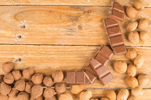 Assorted nuts and sweets on a rustic wooden table