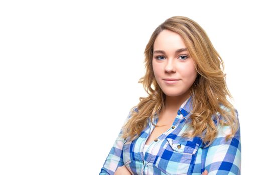 Portrait of beautiful blonde teenager student with blue plaid shirt posing on white background