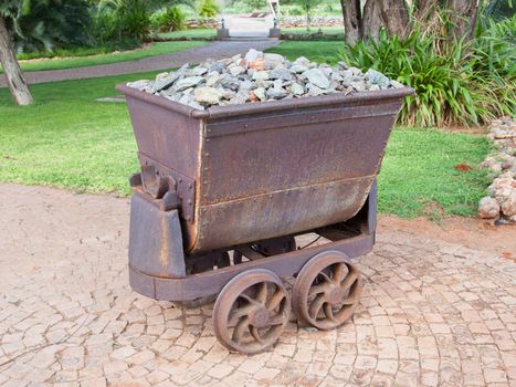 Rusted old mining carriages filled with stones, Namibia