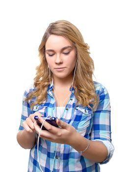 Portrait of beautiful blonde teenager searching music with a smartphone on white background