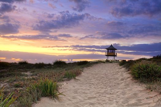 Sandy beach path leading to South Entrance Beach on the Central Coast of NSW, Australia on a beautiful summer sunrise.