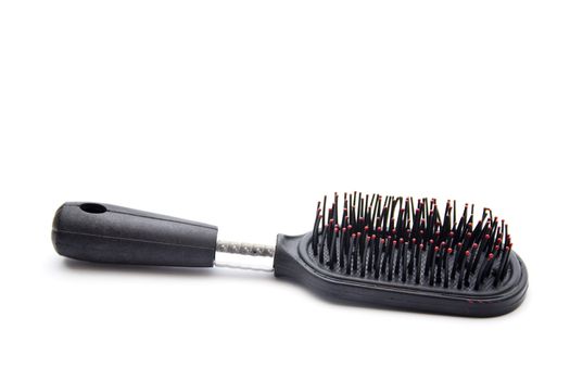 Plastic Hairbrush on white background