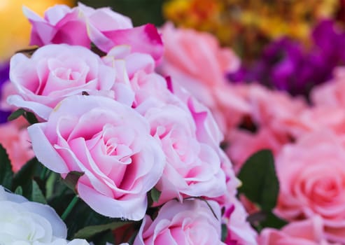 Pink fabric roses,Fake textile pink roses close-up floral background