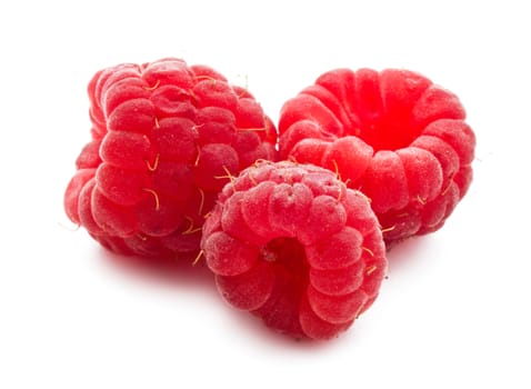 Ripe red raspberries isolated on white background