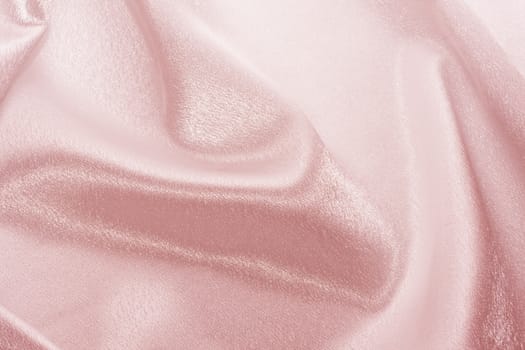 Abstract background pink silk fabric with beautiful waves