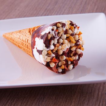 Ice cream over a white plate, close up