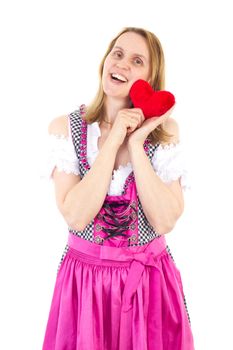 Beautiful girl in pink dirndl happy about upcoming valentines day