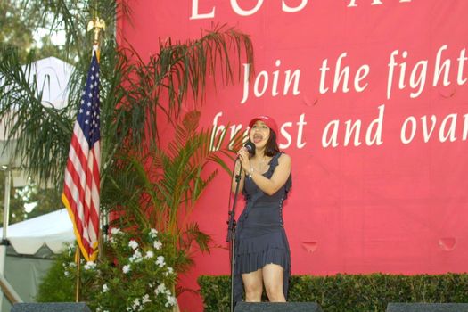 Jennifer Pena sings the National Anthem before the start of festivities at the 11th Annual Revlon Run/Walk For Women to support breast and ovarian cancer research, awareness and prevention programs. Los Angeles Memorial Coliseum, Los Angeles, CA. 05-08-04