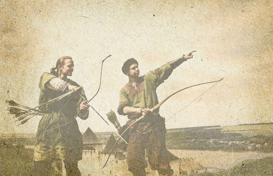 Archers with bows on old paper background