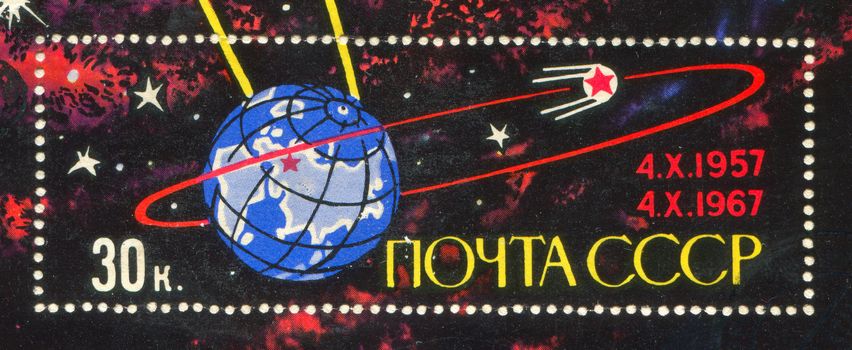 RUSSIA - CIRCA 1967: stamp printed by Russia, shows Sputnik orbiting Earth, circa 1967