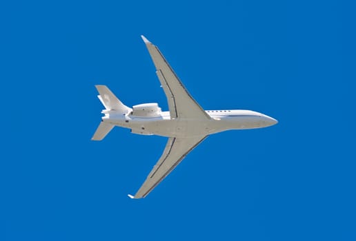 Beautiful white passenger airplane in blue sky