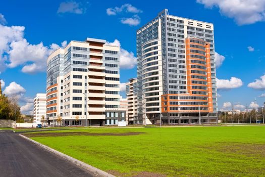 Beautiful view of modern apartment buildings under blue sky