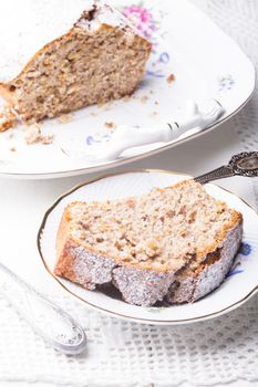 Walnut cake, piece on the plate, close up